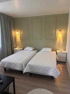 Uma cama ou camas num quarto em Valgemaja Majutus