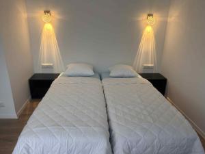 Uma cama ou camas num quarto em Valgemaja Majutus