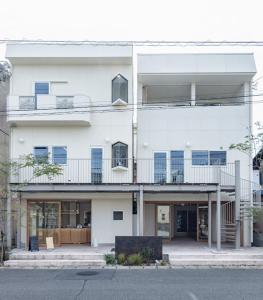 a large white building with a balcony on it at noma - Vacation STAY 21501v in Gifu