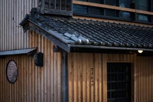 a building with a roof with a window and a door at Eye show - Vacation STAY 78363v in Tsukuba