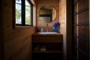 a bathroom with a sink and a mirror at Eye show - Vacation STAY 78363v in Tsukuba