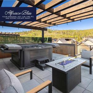 a patio with a hot tub and a table at Gather & Glow in Winter Park