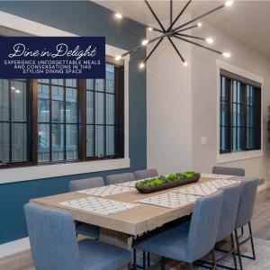 a dining room with a table with blue chairs at Gather & Glow in Winter Park