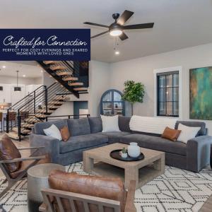 a living room with a couch and a table at Gather & Glow in Winter Park