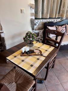 a wooden table with flowers on top of it at Famprika Volissos in Chios