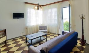 Μια τηλεόραση ή/και κέντρο ψυχαγωγίας στο +61 Lounge Apartment