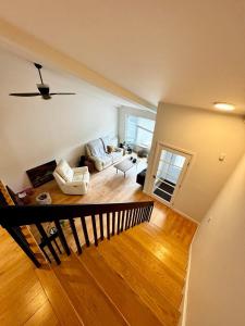 a view of a living room with a couch at Fully furnished cozy home in Montreal