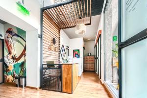 an open hallway with an office with a desk in it at Cocli Hotel Roldanillo in Roldanillo
