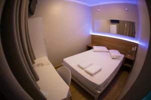Postel nebo postele na pokoji v ubytování Hotel Esplanada