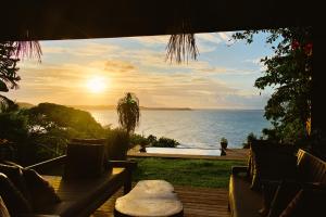 a view of the ocean from a house with a pool at Pipa Villa ByBeck - Praia do Amor - Casa inteira in Pipa