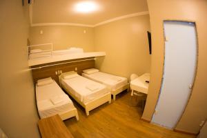Postel nebo postele na pokoji v ubytování Hotel Esplanada