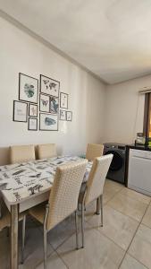 a dining room with a table and chairs at Bright and Cosy appartment in Oulad Yakoub