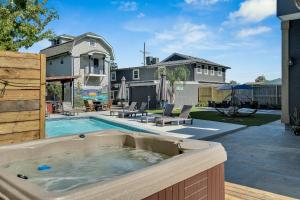 a hot tub in the backyard of a house at Sleeps 24-spacious Suites Near Fq W Pool in New Orleans