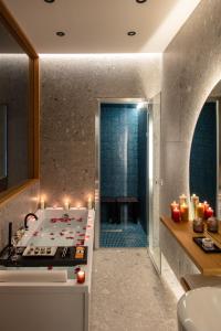 a kitchen with a stove and a sink with candles at Fortunella Suites Luxury in Portici