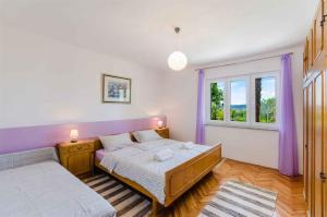 Posteľ alebo postele v izbe v ubytovaní Apartment in Crikvenica 5267