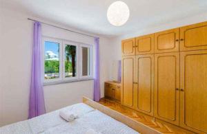 Posteľ alebo postele v izbe v ubytovaní Apartment in Crikvenica 5267