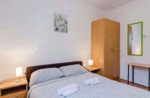 Posteľ alebo postele v izbe v ubytovaní Apartment in Crikvenica 5267