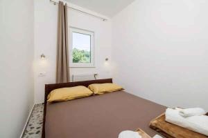 Posteľ alebo postele v izbe v ubytovaní Apartment in Novi Vinodolski 15435