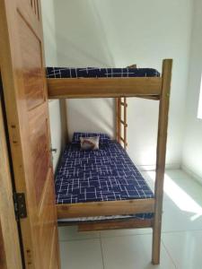 a couple of bunk beds in a room at C&R hostel residência in Salvador