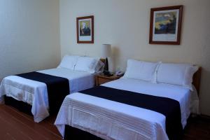 Postel nebo postele na pokoji v ubytování Hotel Calli