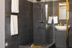 a bathroom with a shower and a sink at L'interdit Love Room - Miroir au plafond 2x2m in Cayenne