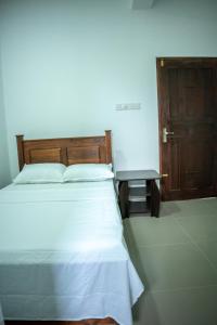 Postel nebo postele na pokoji v ubytování Backpackers GuestHouse Trincomalee