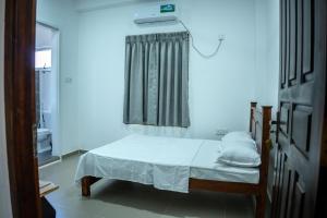 Postel nebo postele na pokoji v ubytování Backpackers GuestHouse Trincomalee