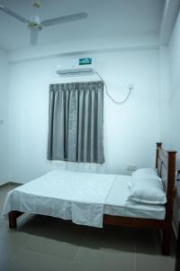 Postel nebo postele na pokoji v ubytování Backpackers GuestHouse Trincomalee