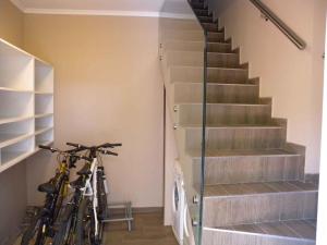two bikes parked in a room with stairs at Apartment in Siofok - Balaton 34933 in Balatonszabadi Fürdőtelep
