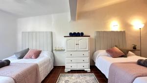 Ένα ή περισσότερα κρεβάτια σε δωμάτιο στο The Villa of Dreams