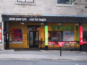 a store front with a sign that reads just for laughs at Huge King Room in 3 BedRoom Great Location Downtown Mtl in Montréal