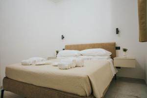 Postel nebo postele na pokoji v ubytování Dalia Suite & Relax