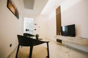 TV a/nebo společenská místnost v ubytování Dalia Suite & Relax