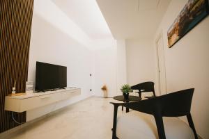 TV a/nebo společenská místnost v ubytování Dalia Suite & Relax