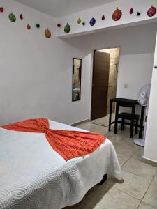 Una cama o camas en una habitación de Manuel Muñiz