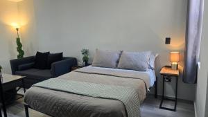 Ένα ή περισσότερα κρεβάτια σε δωμάτιο στο Depto Tec by tuhost