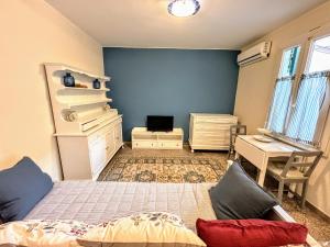 Postel nebo postele na pokoji v ubytování La Casina al Mare - Marina di Carrara