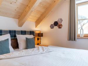 Postel nebo postele na pokoji v ubytování Alpenjoy Lodge
