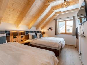 Postel nebo postele na pokoji v ubytování Alpenjoy Lodge