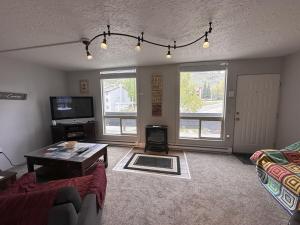 a living room with a couch and a coffee table at Dillon Valley Mountain Escape in Dillon