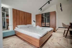 Ένα ή περισσότερα κρεβάτια σε δωμάτιο στο A&A Comfort Apartments