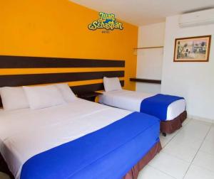 Rúm í herbergi á Hotel Juan Sebastián