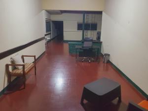 a hallway with chairs and a table in a room at SAM TRAVEL LEON in León