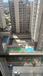 an aerial view of a city with tall buildings at Águas Claras in Brasilia