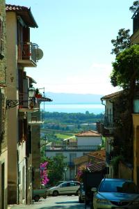 a view of a city street with cars parked at Ospitalità Perusia in Tuoro sul Trasimeno