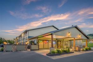 a rendering of a building at dusk at Best Western Black Hills Lodge in Spearfish