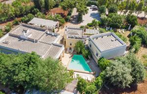 an aerial view of a house with a swimming pool at Casal Del Borgo 3 in Ostuni +39 photos