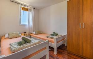 Łóżko lub łóżka w pokoju w obiekcie Holiday Home Medulin 33