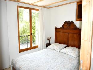 Ένα ή περισσότερα κρεβάτια σε δωμάτιο στο Holiday Home in Saint-Honore - Les Bains