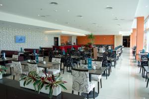 Un restaurant u otro lugar para comer en Gala Hotel y Convenciones